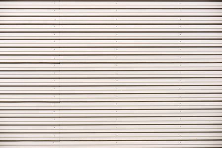 Close-up of the galvanized metal facade of a factory.の写真素材