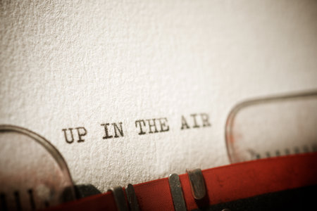 Up in the air text written with a typewriter.の写真素材