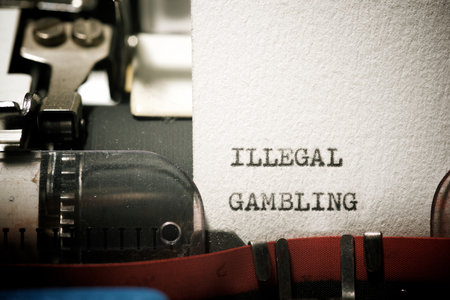 Illegal gambling text written with a typewriter.の写真素材