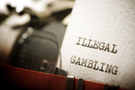 Illegal gambling text written with a typewriter.の写真素材