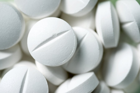 Close-up of white medicine pills in a plastic canisterの写真素材