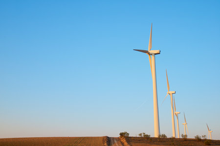 Wind turbine generators for sustainable electrical energy production at sunriseの写真素材