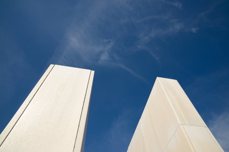 View from below of a marble monoliths and blue skyの写真素材