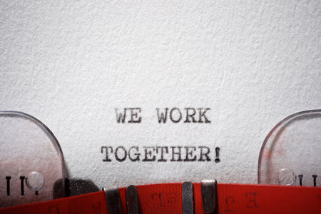 We work together text written with a typewriter.の写真素材