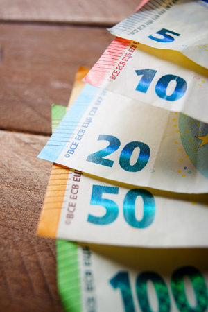 European Union banknotes stacked on a tableの写真素材