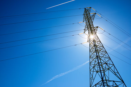 Silhouette of a high voltage tower in Spainの写真素材