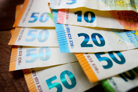European Union banknotes stacked on a tableの写真素材