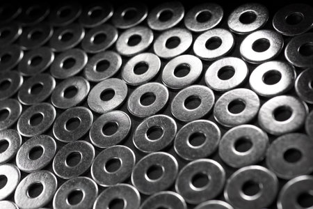 Close-up of many metal washers on a table.の写真素材