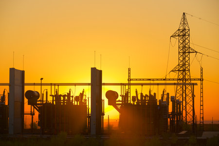 Electrical substation for energy distribution and orange sky