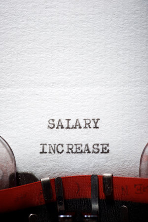 Salary increase phrase written with a typewriter.の写真素材
