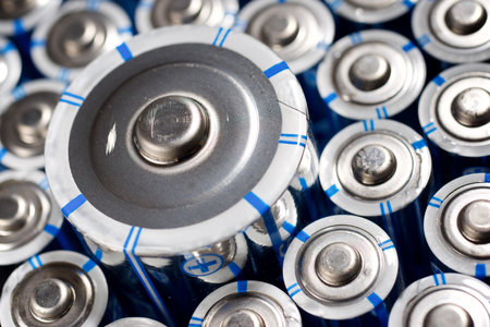 Close up of a large group of batteries on a table