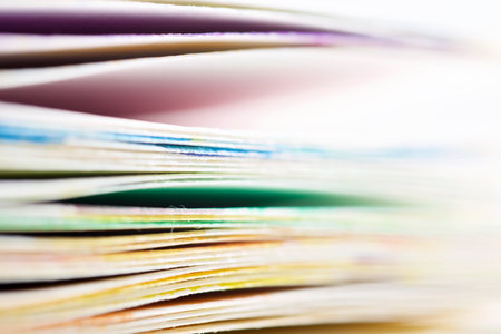 Close-up of a pile of sheets of paper colored with watercolors