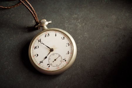 Close up of a vintage pocket clock on a table