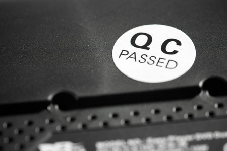 Quality control passed sticker on a black electronic device.