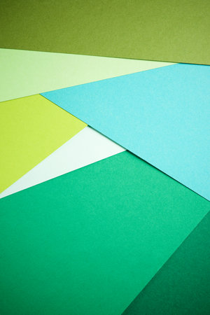 Background created with the foreground of stacked green cardstocksの写真素材