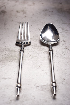 Close up of a fork and spoon on a kitchen tableの写真素材