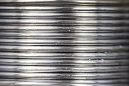 Background created with the foreground of a coiled tin wire.