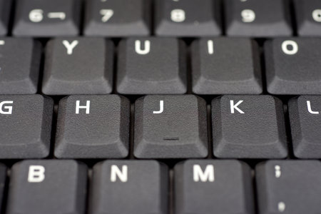 Close up of the black keyboard of a laptop computerの写真素材