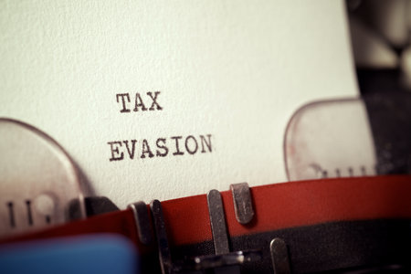 Tax evasion text written with a typewriter.の写真素材