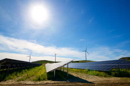 Many photovoltaic panels for sustainable electrical energy production and windmills in Zaragoza...