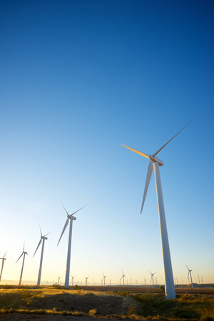 Wind turbine generators for sustainable electrical energy production at sunriseの写真素材