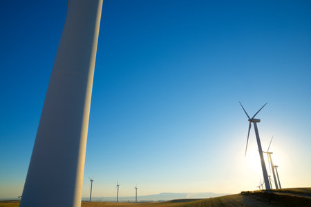 Wind turbine generators for sustainable electrical energy production at sunriseの写真素材