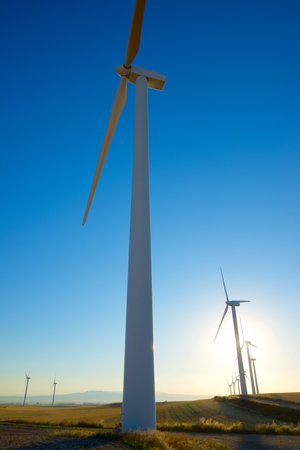 Wind turbine generators for sustainable electrical energy production at sunriseの写真素材