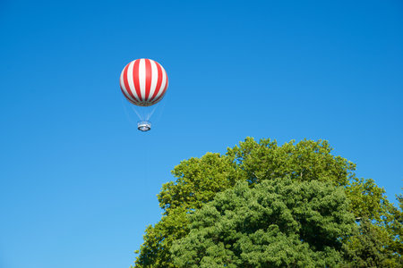 Sightseeing balloon through the trees in Varosliget Park in Budapest, Hungary.の写真素材