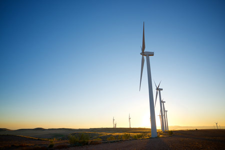 Wind turbine generators for sustainable electrical energy production at sunriseの写真素材