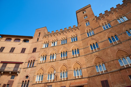 Building facade detail in Campo Square in Siena, Tuscany, Italy.の写真素材