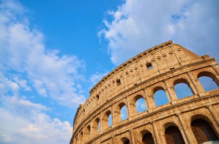 Exterior view of the Roman Colosseum in Rome at sunset.の写真素材
