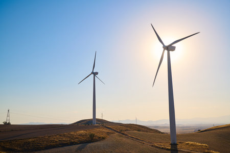 Windmills for renewable electrical production and clear skyの写真素材
