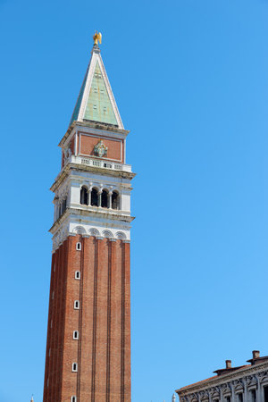View of the red brick tower known as Campanile, St. Mark's Square in Venice, Italy.の写真素材