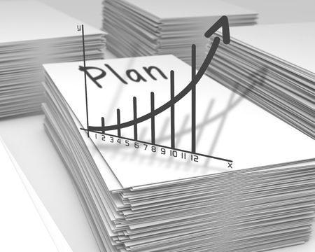 Stacks of paper with a plan graph