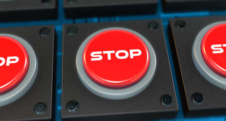 Red button pressed with stop text as backgroundの写真素材