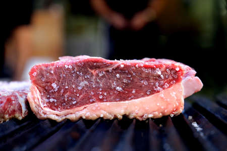 Raw steak. Traditional Steak barbecue in Brazil. Slices of Picanha.