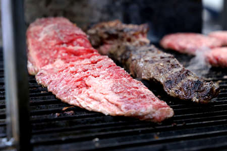 Skirt steak. Steak. Traditional cut of meat for a Brazilian barbecue. Meat on the grill.の写真素材