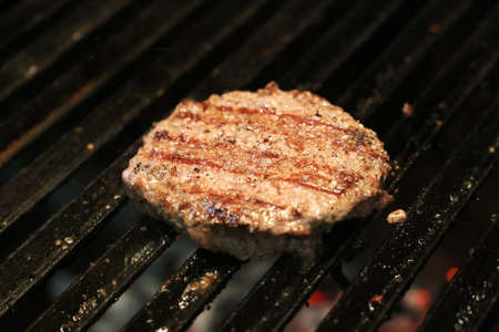 hamburger on the parrilla grill with grill marks.の写真素材