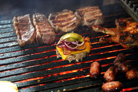 full grill on a Brazilian barbecue. Steaks, Burgers, Sausages.の写真素材