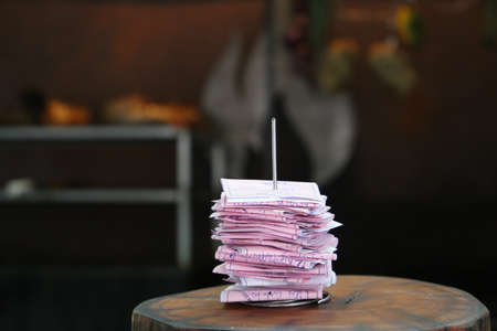 control block of a restaurant. Papers with customer orders.の写真素材