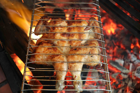 Whole chicken grilled on a barbecue. Brazilian food.の写真素材