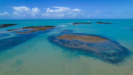 Aerial view of Praia do Espelho, Porto Seguro, Bahia, Brazil. Natural pools in the sea, cliffs and greenish water.の写真素材