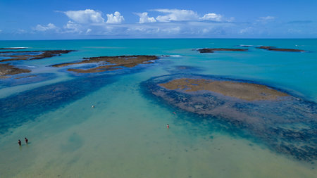 Aerial view of Praia do Espelho, Porto Seguro, Bahia, Brazil. Natural pools in the sea, cliffs and greenish water.の写真素材