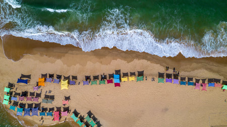 Aerial view of Caraiva beach, Porto Seguro, Bahia, Brazil. Colorful beach tents, sea and river.の写真素材