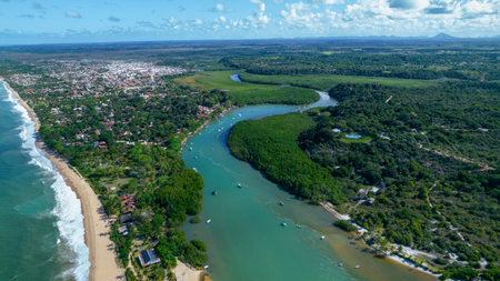 Aerial view of Caraiva beach, Porto Seguro, Bahia, Brazil. Colorful beach tents, sea and river.の写真素材