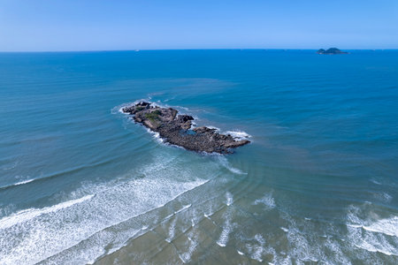 Aerial view of an island in the ocean.の写真素材