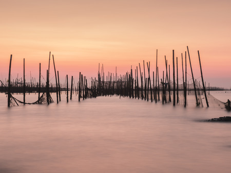 Old fishing nets in twilightの写真素材