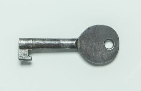 The old key with a white background.の写真素材