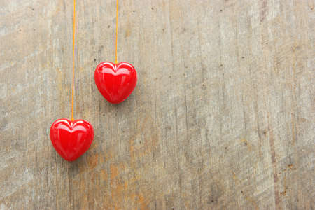 two Red heart background, old wood.の写真素材