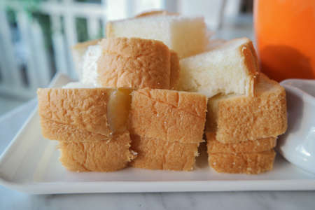 Toast with jam in a glass of Orange